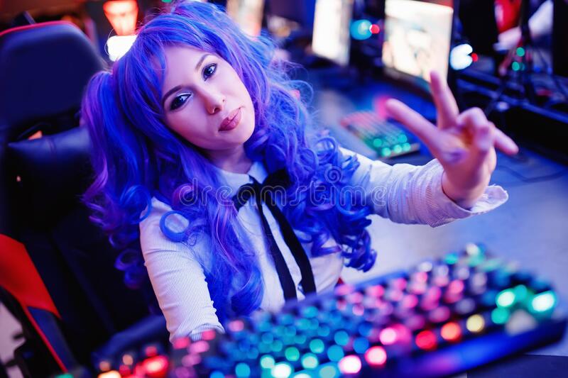Cosplay Young Beautiful Woman Blue Hair Welcomes Subscribers To Stream Video Games Neon Color 182051908